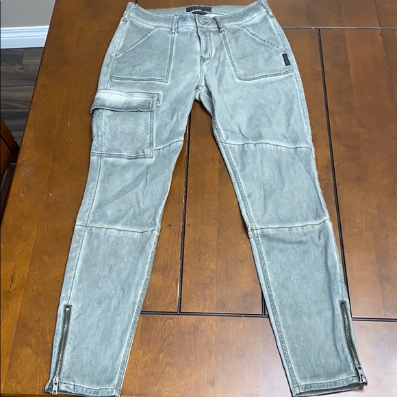 Silver skinny cargo style pants with ankle zippers